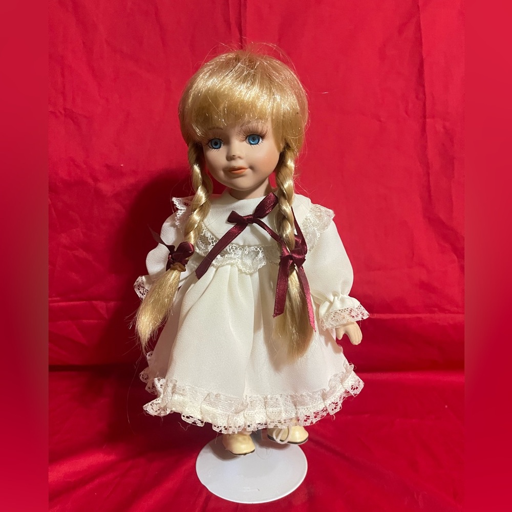 Collection Heidi porcelain doll, approximately 12inches tall-with stand